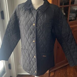 Barbour Women's Dark Quilted Utility Jacket with black corduroy collar.